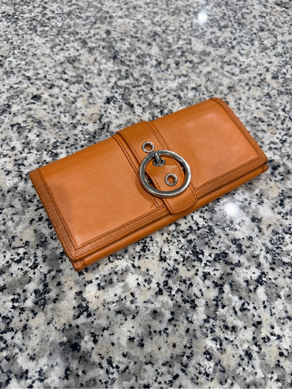 Orange Coach SoHo Leather Wallet with Silver Ring Accent